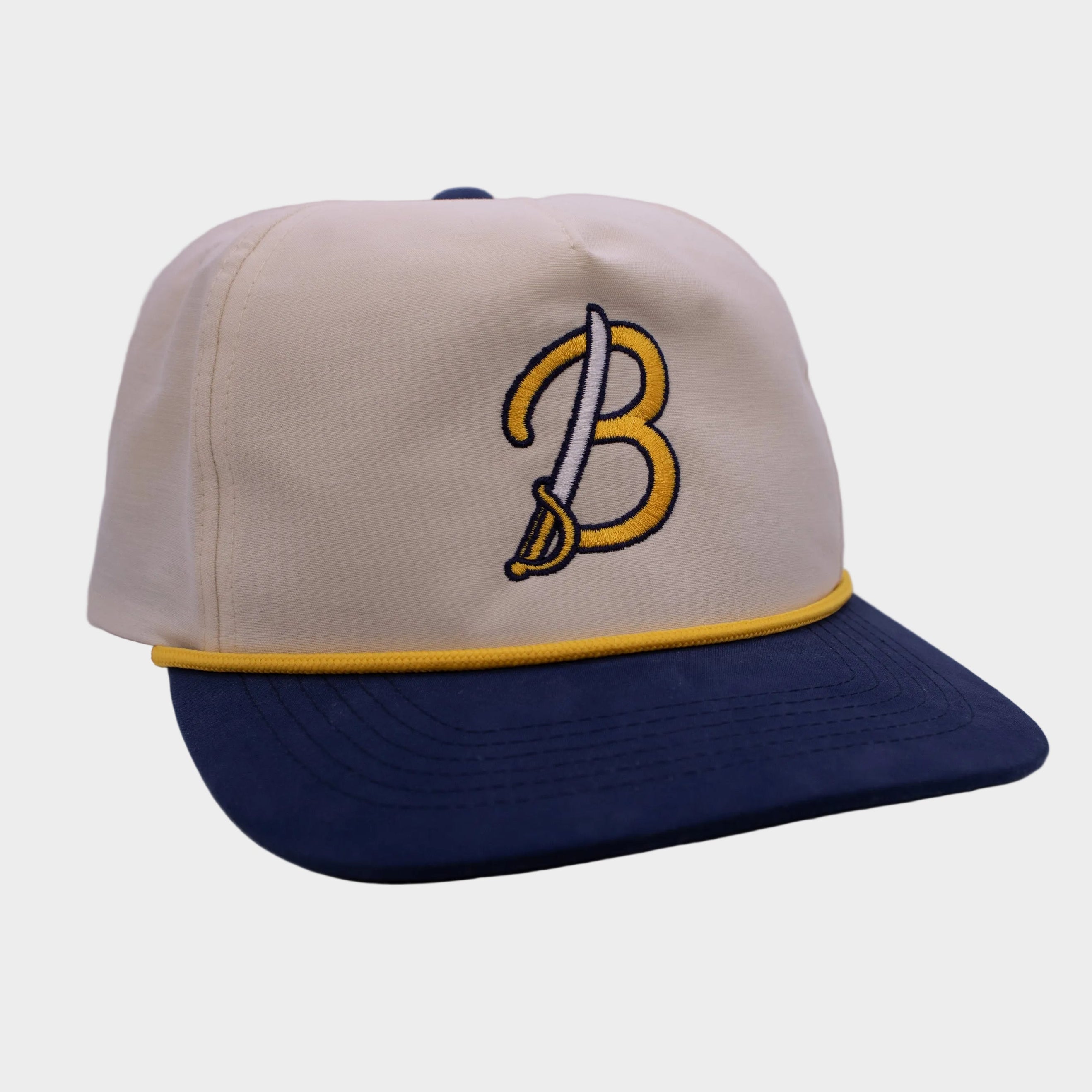 Beige and navy cap with yellow accents on a light gray background