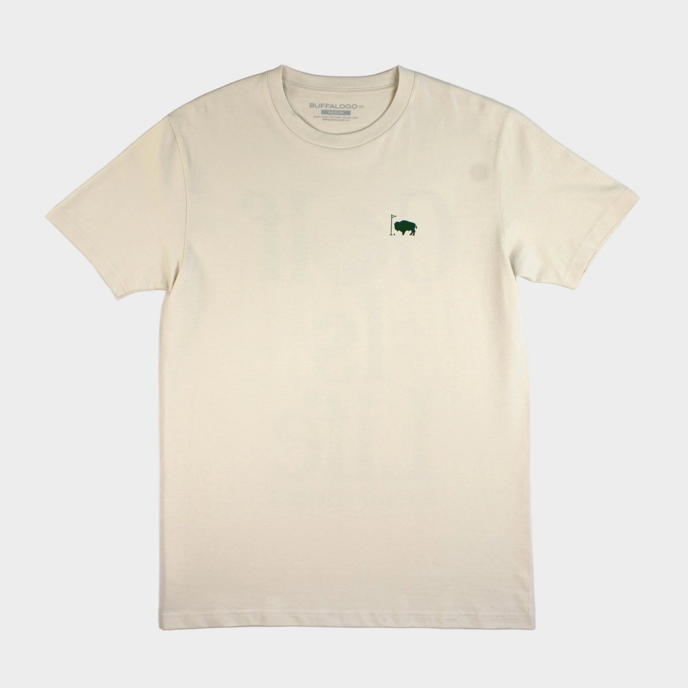 Beige t-shirt with a small green logo on a white background