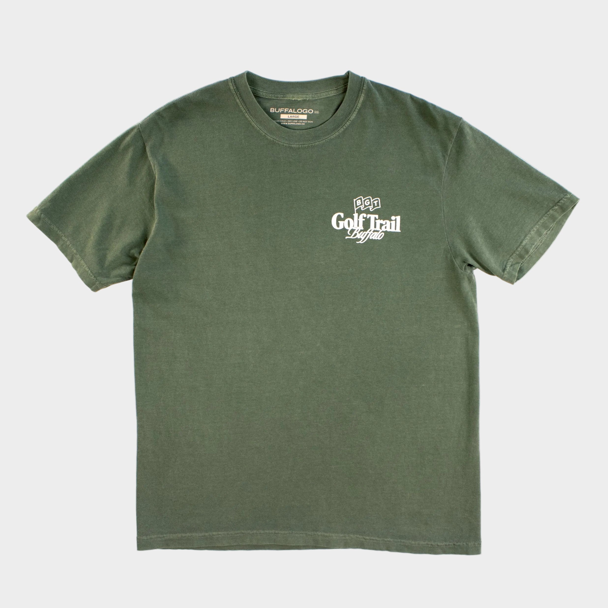 Green t-shirt with a logo on a beige background