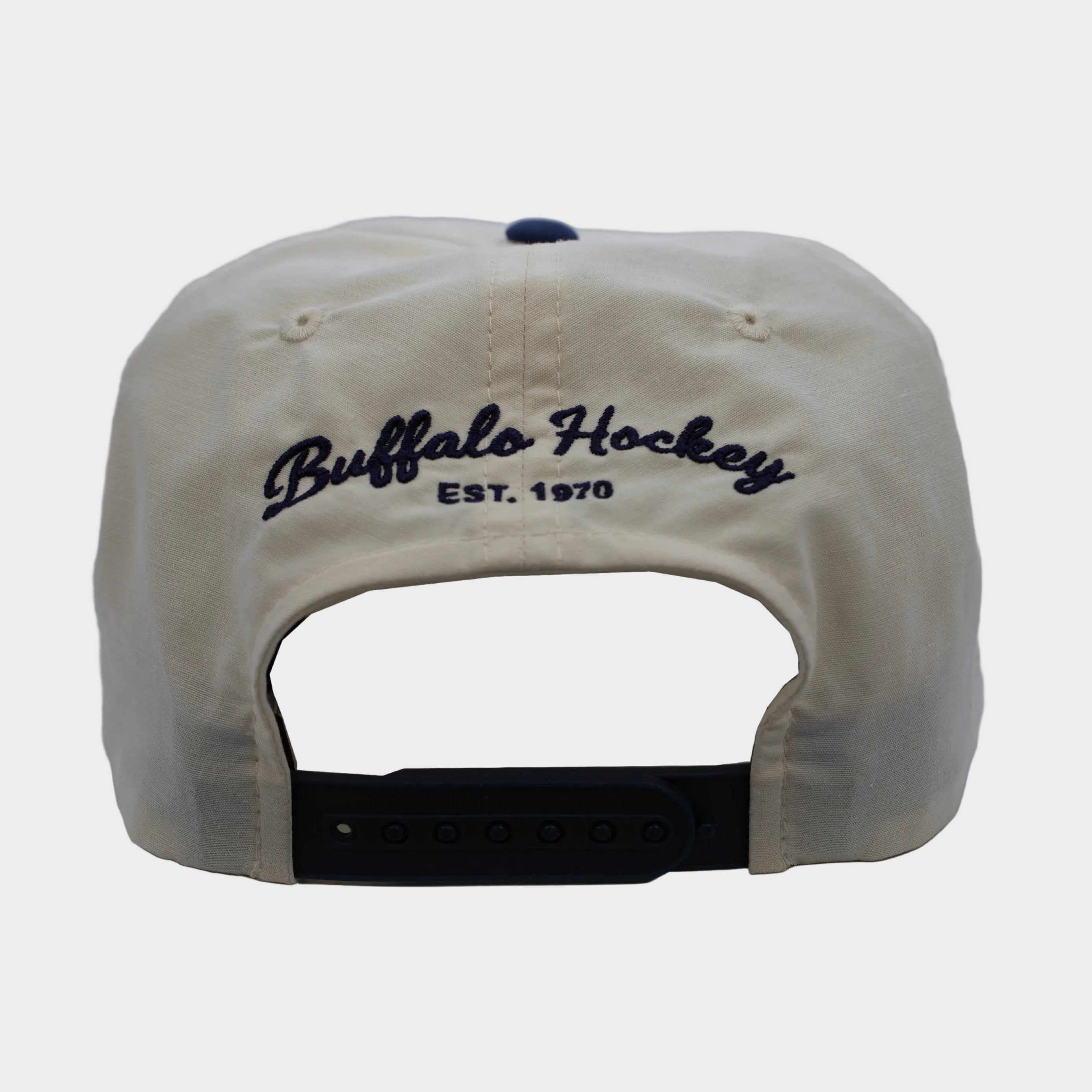 Beige cap with 'Buffalo Hockey EST. 1970' text on a gray background